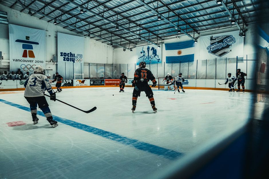 Exciting ice hockey game taking place indoors in Buenos Aires, showcasing competitive players in action.