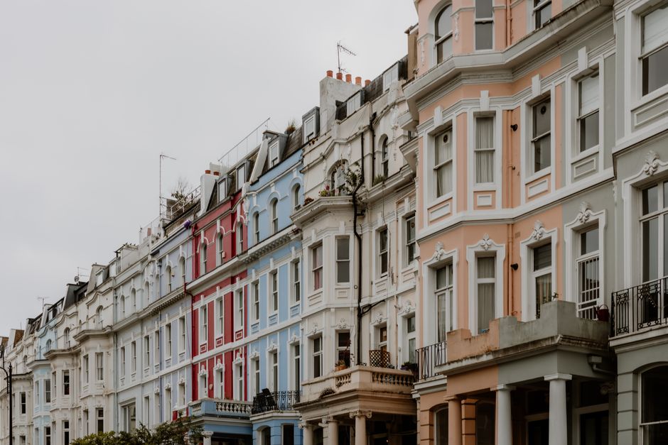 Explore the charm of colorful Victorian row houses lining a city street, showcasing urban elegance.